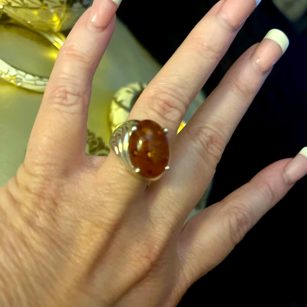 Sterling silver and Amber ring. Unique design. Size 8. Very pretty pretty.
